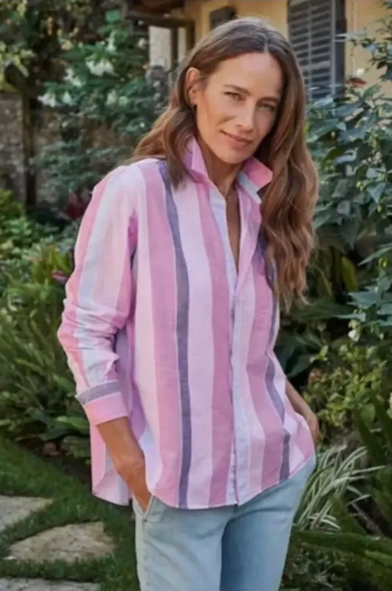 Woman wearing a Frank & Eileen linen striped shirt in an outdoor setting